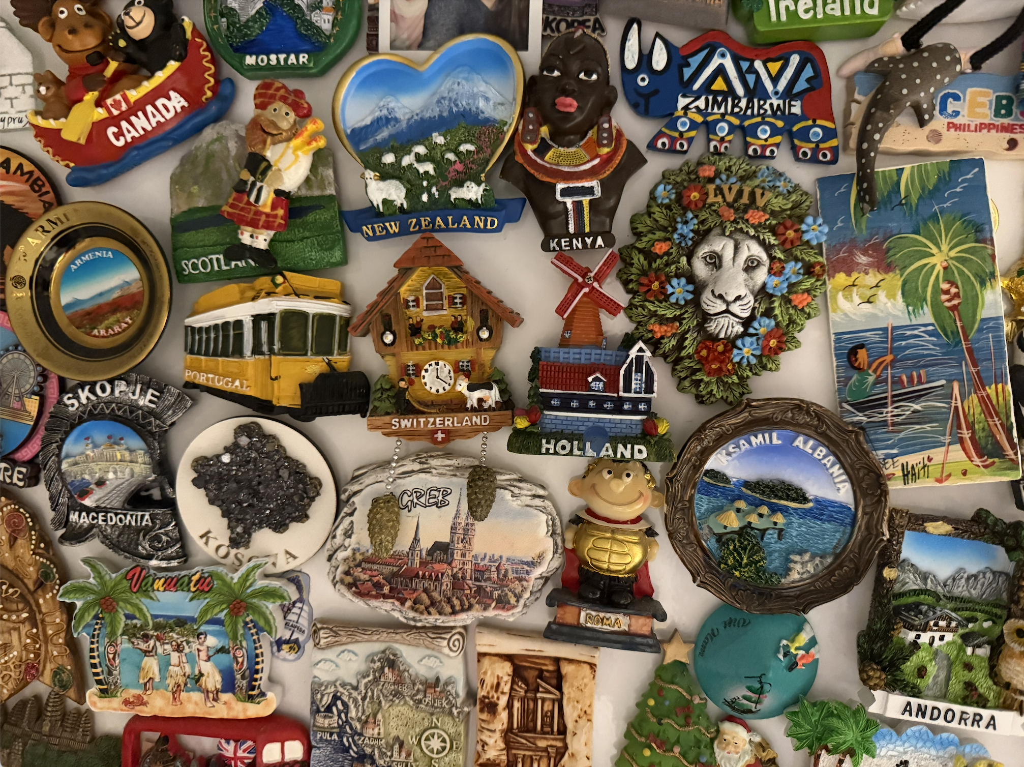 A wall of travel souvenir magnets